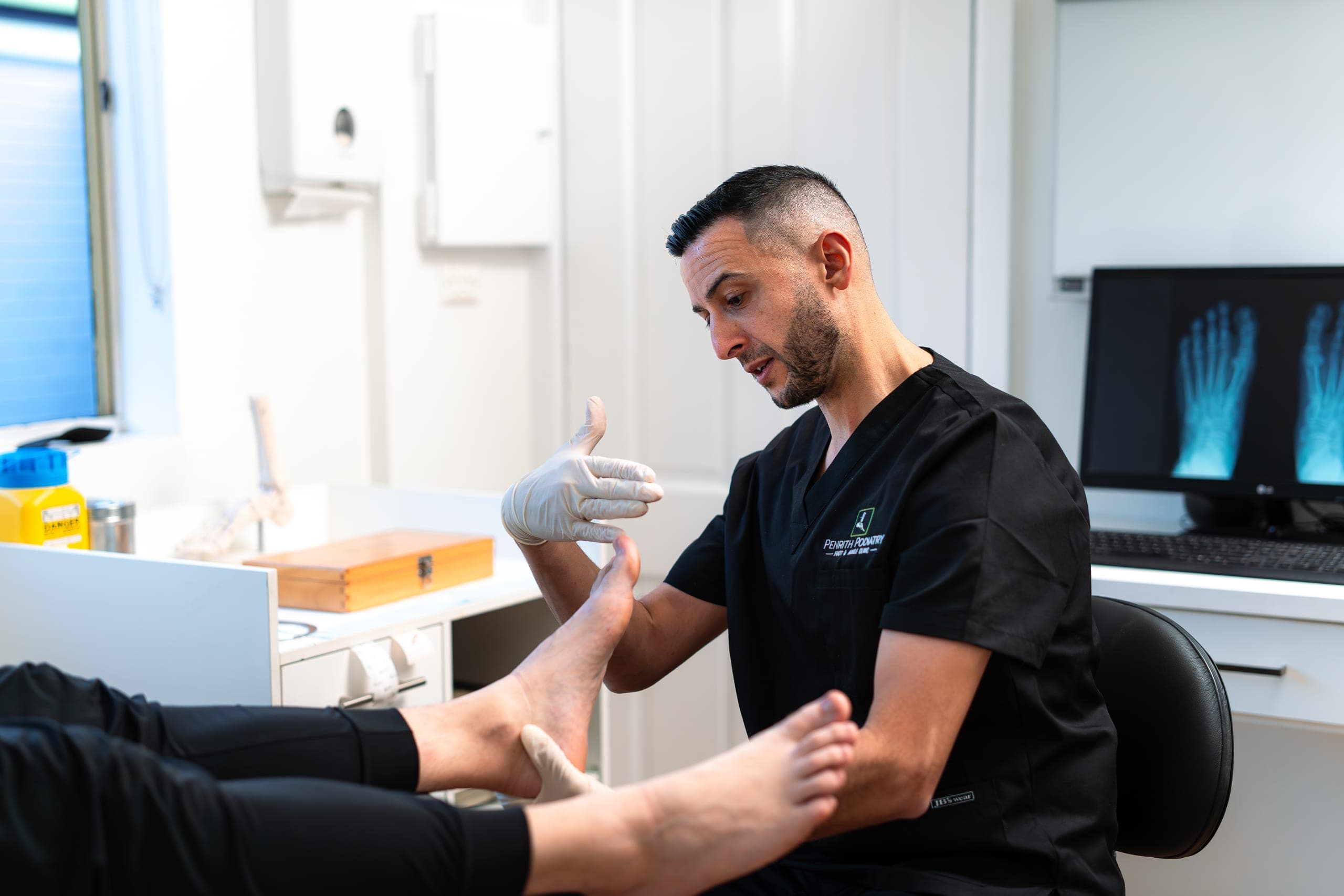 Penrith Podiatry clinician assessing a patient's foot