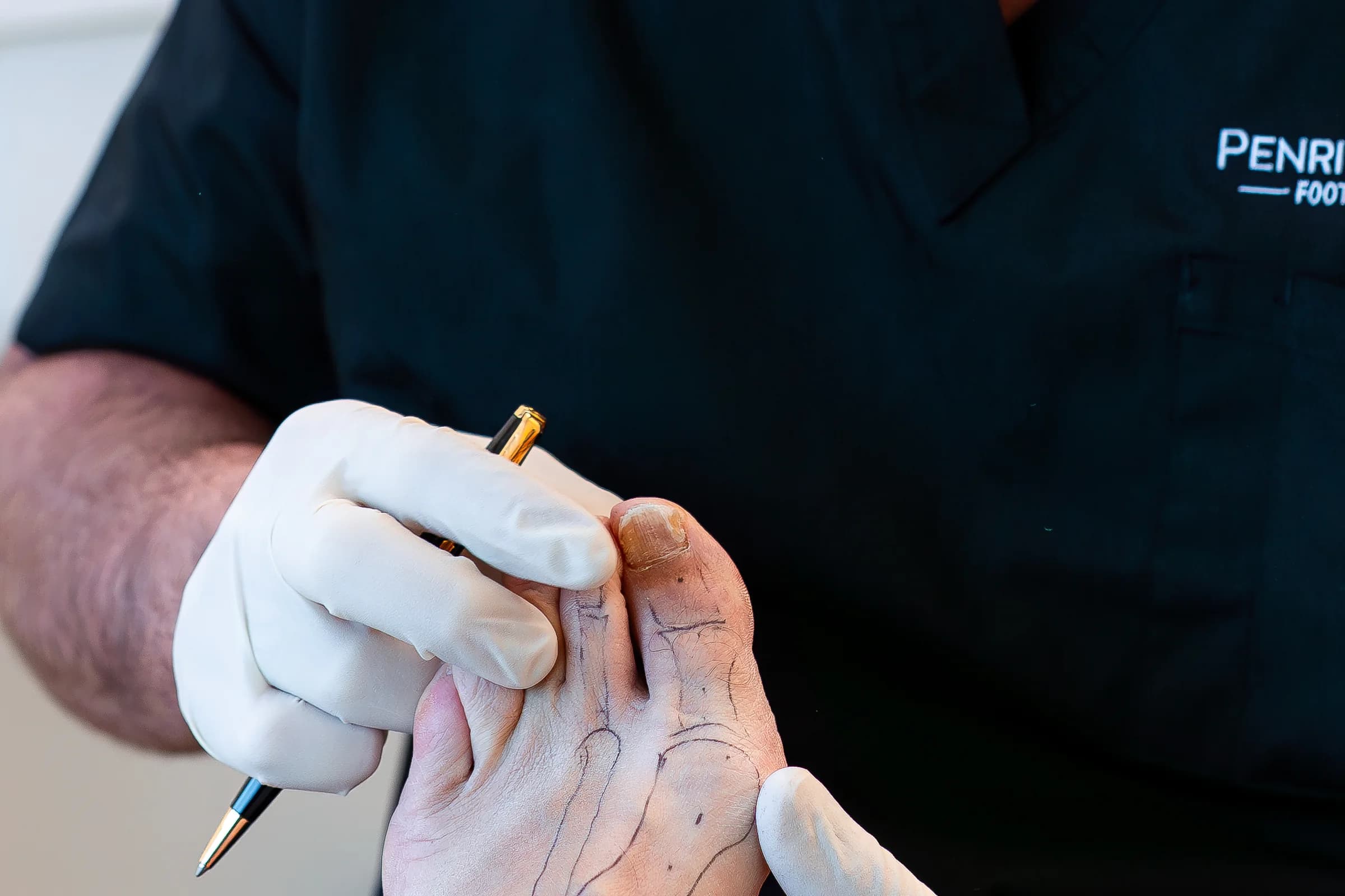 Penrith Podiatry Clinic podiatrist assessing a patient's foot during an examination