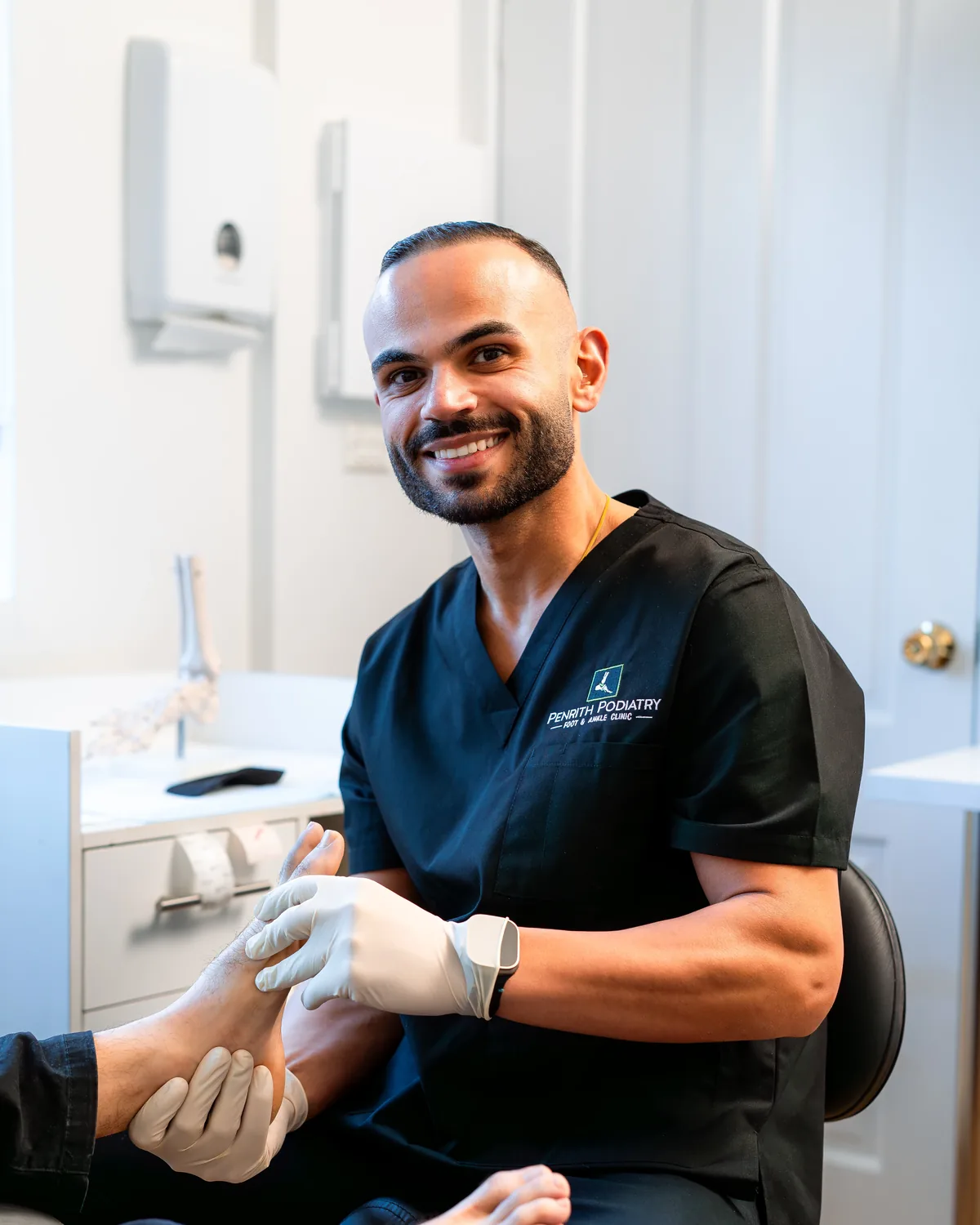 Penrith Podiatry podiatrist assessing a patient's foot in the clinic