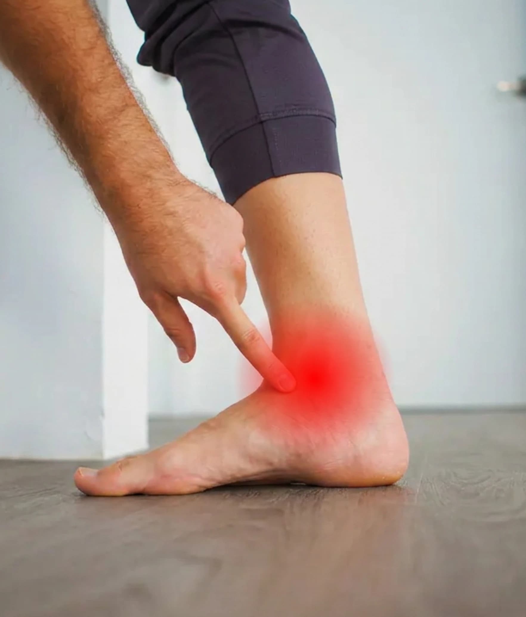 The inner ankle and arch highlighted, where the posterior tibial tendon is painful